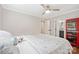 Neutral bedroom with a ceiling fan features hardwood floors, fresh paint, and an en-suite bathroom at 1755 Simplicity Rd, Concord, NC 28025