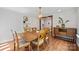 Open dining room featuring wood floors, a modern chandelier, and rustic wood doorway at 1755 Simplicity Rd, Concord, NC 28025