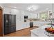 Modern kitchen featuring white cabinets, quartz countertops, and stainless steel appliances at 1755 Simplicity Rd, Concord, NC 28025