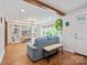 Cozy living room with exposed wood beam and custom built-in shelving at 1755 Simplicity Rd, Concord, NC 28025