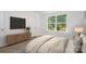Bright bedroom with a large window and hardwood floors at 1803 Country Club Rd, Lincolnton, NC 28092