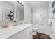 Bathroom featuring double sinks with modern fixtures, a bathtub, and marble design tile at 1809 Country Club Rd, Lincolnton, NC 10757