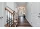 Inviting hallway with hardwood floors, a staircase, and ample natural light streaming through the front door at 1809 Country Club Rd, Lincolnton, NC 10757