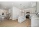 Modern kitchen with stainless steel appliances, white cabinets, a central island, and stylish pendant lighting at 1809 Country Club Rd, Lincolnton, NC 10757