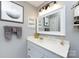 Modern bathroom with vanity, framed mirror, recessed lighting, and decorative accents at 18861 Vineyard Point Ln, Cornelius, NC 28031