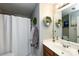 Bathroom with shower and bathtub combination and decorative shelving at 18861 Vineyard Point Ln, Cornelius, NC 28031