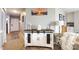 Hallway with console table, stylish decor and an adjacent kitchen view at 18861 Vineyard Point Ln, Cornelius, NC 28031