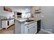 The kitchen features granite counters and a seamless transition to the living area at 18861 Vineyard Point Ln, Cornelius, NC 28031