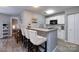 Kitchen with bar seating, granite countertops, and modern appliances at 18861 Vineyard Point Ln, Cornelius, NC 28031