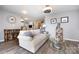 Cozy living room with elegant sofa and stylish coffee table setup at 18861 Vineyard Point Ln, Cornelius, NC 28031