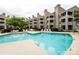 Community swimming pool surrounded by lounge chairs and overlooking the condominium complex at 18861 Vineyard Point Ln, Cornelius, NC 28031