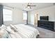 Comfortable primary bedroom with a ceiling fan and a dresser at 1905 Summey Ave, Charlotte, NC 28205