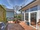 Spacious deck with view of mature greenery, landscaping, and access to screened porch at 1905 Summey Ave, Charlotte, NC 28205