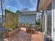 Outdoor deck featuring a wooden lattice screen, potted plants, and partial view of a house at 1905 Summey Ave, Charlotte, NC 28205