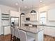 Bright kitchen with white cabinets, stainless steel appliances, and granite countertops at 1905 Summey Ave, Charlotte, NC 28205