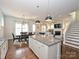 Spacious open kitchen with island that leads into the dining and living room areas at 1905 Summey Ave, Charlotte, NC 28205