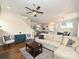 Open-concept living area showcasing hardwood floors and access to kitchen and dining at 1905 Summey Ave, Charlotte, NC 28205