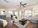 Open-concept living room with hardwood floors and natural light at 1905 Summey Ave, Charlotte, NC 28205