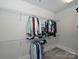 Spacious walk-in closet featuring metal shelving for clothing storage, providing ample organization in neutral tones at 1905 Summey Ave, Charlotte, NC 28205