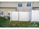 Private backyard area featuring a white privacy fence and manicured lawn at 2021 Lennox Square Rd, Charlotte, NC 28210