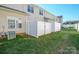 Well-maintained backyard with lush grass and a secure white privacy fence at 2021 Lennox Square Rd, Charlotte, NC 28210