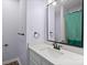 Bright bathroom featuring a modern vanity with a white countertop and stylish black fixtures at 2021 Lennox Square Rd, Charlotte, NC 28210