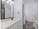 Modern bathroom with stylish fixtures, a bathtub, shower and sleek design at 2021 Lennox Square Rd, Charlotte, NC 28210