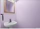 This powder room features modern fixtures and a stylish design at 2021 Lennox Square Rd, Charlotte, NC 28210
