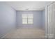 Spacious bedroom with window and closet at 2021 Lennox Square Rd, Charlotte, NC 28210