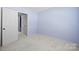 Neutral bedroom with carpet and closet at 2021 Lennox Square Rd, Charlotte, NC 28210
