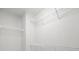 A walk-in closet features white wire shelving at 2021 Lennox Square Rd, Charlotte, NC 28210