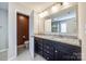Modern bathroom featuring a double sink vanity with granite countertops and a separate toilet area at 2076 Brightflower Ln, York, SC 29745