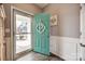 Bright foyer featuring a glass storm door, wood floors, and a decorative door hanger at 2076 Brightflower Ln, York, SC 29745