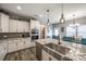 Open-concept kitchen with stainless steel appliances, a large island, and a view to the dining area at 2076 Brightflower Ln, York, SC 29745