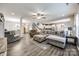 Spacious living room featuring modern flooring, a ceiling fan, and an open layout at 2076 Brightflower Ln, York, SC 29745