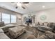 Comfortable living room with large windows, ceiling fan, and modern furnishings at 2076 Brightflower Ln, York, SC 29745