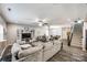 Bright and airy living room with an open floor plan, stairs to the second floor, and modern decor at 2076 Brightflower Ln, York, SC 29745