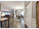 Open-concept living and dining area with modern flooring, neutral tones, and abundant natural light at 2076 Brightflower Ln, York, SC 29745