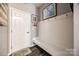 Functional mudroom with a bench, coat hooks, and convenient access to the entryway at 2076 Brightflower Ln, York, SC 29745