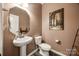 Charming powder room featuring pedestal sink, decorative mirror, and modern fixtures at 2076 Brightflower Ln, York, SC 29745