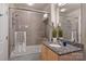Bathroom featuring a shower over tub, granite counters, a modern vanity and a large mirror at 210 N Church St # 1413, Charlotte, NC 28202