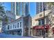 A view of a building exterior with restaurants at 210 N Church St # 1413, Charlotte, NC 28202