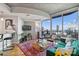 Chic living room featuring floor-to-ceiling windows showcasing stunning city views at 210 N Church St # 1413, Charlotte, NC 28202