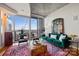 Stylish living room with modern decor and expansive windows overlooking the city skyline at 210 N Church St # 1413, Charlotte, NC 28202