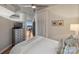 Comfortable bedroom with a ceiling fan and walk-out to a balcony with great views at 210 N Church St # 1413, Charlotte, NC 28202