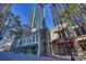 A vibrant city street featuring charming architecture beneath towering skyscrapers and sunny blue skies at 210 N Church St # 1413, Charlotte, NC 28202