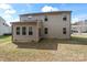Two-story home displaying a neutral-toned siding and a well-maintained backyard at 2177 Galloway Sw Ln, Concord, NC 28025
