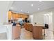 Well-lit kitchen featuring an island, stainless steel appliances, ample cabinet space, and an adjacent living area at 2177 Galloway Sw Ln, Concord, NC 28025