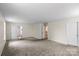 Spacious living room features neutral paint and plush carpeting at 2177 Galloway Sw Ln, Concord, NC 28025