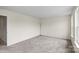 Bright living room featuring plush carpet, large windows, and ample space at 2177 Galloway Sw Ln, Concord, NC 28025